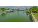 Scenic waterfront view with docks and homes reflecting on the calm canal waters at 721 Old Compass Rd, Longboat Key, FL 34228