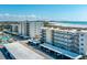 Enjoy an aerial view of the beachfront condo with convenient covered parking and sparkling swimming pool at 757 Beach Rd # 300, Sarasota, FL 34242