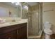 Bathroom showcasing a glass shower, vanity with counter space and modern fixtures at 757 Beach Rd # 300, Sarasota, FL 34242