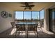 Relax on this tiled lanai with a ceiling fan and views of the beach at 757 Beach Rd # 300, Sarasota, FL 34242