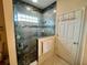 Bathroom with walk-in shower, double sinks, and built-in storage at 7619 Teal Trace, Bradenton, FL 34203