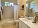 Clean bathroom with a bathtub shower combo at 7619 Teal Trace, Bradenton, FL 34203