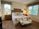 Bright bedroom with a king-size bed and tropical decor at 7619 Teal Trace, Bradenton, FL 34203