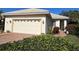 One-story home with attached garage and landscaped front yard at 7619 Teal Trace, Bradenton, FL 34203