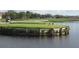 Elevated tee box overlooking a pond at 7619 Teal Trace, Bradenton, FL 34203