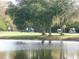 Golf course with pond and lush trees at 7619 Teal Trace, Bradenton, FL 34203