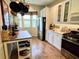 Bright kitchen with white cabinets, stainless steel appliances and kitchen island at 7619 Teal Trace, Bradenton, FL 34203