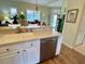 Kitchen features a breakfast bar and stainless steel dishwasher at 7619 Teal Trace, Bradenton, FL 34203