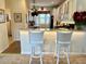 Kitchen with breakfast bar and white cabinetry at 7619 Teal Trace, Bradenton, FL 34203