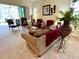 Spacious living room featuring comfortable seating and a large window at 7619 Teal Trace, Bradenton, FL 34203