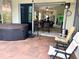 Screened patio with hot tub and view of the living room at 7619 Teal Trace, Bradenton, FL 34203