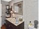 Well-appointed bathroom boasts a marble-topped vanity and updated fixtures at 796 Capri Isles Blvd # 241, Venice, FL 34292