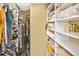 Large walk-in closet with double hanging rods and shelving at 796 Capri Isles Blvd # 241, Venice, FL 34292