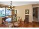 Bright dining area with a round glass table and wicker chairs at 796 Capri Isles Blvd # 241, Venice, FL 34292