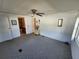 Bedroom with carpet, fan and bathroom access at 808 53Rd E Ave # 9, Bradenton, FL 34203