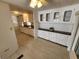 Open kitchen with white cabinets and a breakfast bar at 808 53Rd E Ave # 9, Bradenton, FL 34203