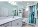 Guest bathroom with tub shower combo and modern vanity at 8501 Starlight Loop, Parrish, FL 34219