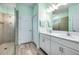 Bathroom boasts double vanity and a large shower at 8501 Starlight Loop, Parrish, FL 34219