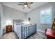 Bedroom with an antique metal bed frame and wood flooring at 8501 Starlight Loop, Parrish, FL 34219