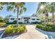 Community pool bathhouse with palm trees and walkway at 8501 Starlight Loop, Parrish, FL 34219