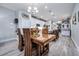 Spacious dining area with a large wood table and chandelier at 8501 Starlight Loop, Parrish, FL 34219