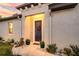 Inviting front door entry with decorative wreath and potted plants at 8501 Starlight Loop, Parrish, FL 34219