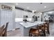 Modern kitchen with white cabinets, quartz countertops, and stainless steel appliances at 8501 Starlight Loop, Parrish, FL 34219