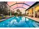 Enclosed pool and patio area with tranquil sunset views at 8501 Starlight Loop, Parrish, FL 34219