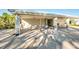 Covered patio area with tables and chairs near the pool at 8501 Starlight Loop, Parrish, FL 34219