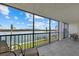 Spacious balcony overlooking the water with outdoor seating at 9393 Midnight Pass Rd # 302, Sarasota, FL 34242