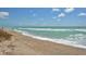 Scenic beach view with ocean waves and sandy shore at 9393 Midnight Pass Rd # 302, Sarasota, FL 34242