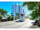 Gated community entrance with tall residential building at 9393 Midnight Pass Rd # 302, Sarasota, FL 34242