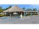 Beachside restaurant with outdoor seating under a palapa at 9393 Midnight Pass Rd # 302, Sarasota, FL 34242