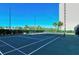 Community tennis court with building in background at 9393 Midnight Pass Rd # 302, Sarasota, FL 34242