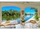 Covered patio with serene canal views at 9393 Midnight Pass Rd # 302, Sarasota, FL 34242