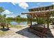 Relaxing waterfront pavilion with picnic tables at 9393 Midnight Pass Rd # 302, Sarasota, FL 34242