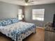 Bright bedroom with a king-size bed and seashell bedding at 96 Drifting Sands Dr, Venice, FL 34293