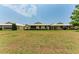 Back view of villas with grassy lawn at 96 Drifting Sands Dr, Venice, FL 34293