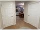 Bright hallway with light wood floors and neutral walls at 96 Drifting Sands Dr, Venice, FL 34293