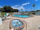 Community pool and spa with lounge chairs at 96 Drifting Sands Dr, Venice, FL 34293