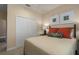 Bright bedroom with a comfortable bed, neutral walls, and ample closet space at 10624 Falling Leaf Ct, Parrish, FL 34219