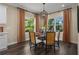 Bright dining room with a glass-top table and cane chairs at 10624 Falling Leaf Ct, Parrish, FL 34219