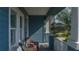 Relaxing front porch with wicker chairs, offering a peaceful outdoor seating area at 10624 Falling Leaf Ct, Parrish, FL 34219