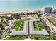 Aerial view of coastal property, showing building and ocean at 100 The Esplanade N # 6, Venice, FL 34285