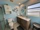 Bathroom with double vanity, marble countertop, and walk-in shower at 100 The Esplanade N # 6, Venice, FL 34285