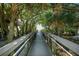 Boardwalk path leading to beach through lush foliage at 100 The Esplanade N # 6, Venice, FL 34285