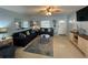 Living room with sofas, TV, and coastal decor at 100 The Esplanade N # 6, Venice, FL 34285