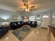 Living room with seating and coastal decor at 100 The Esplanade N # 6, Venice, FL 34285