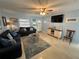 Living room with sofas, TV, and coastal decor at 100 The Esplanade N # 6, Venice, FL 34285