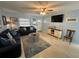 Relaxing living room with comfy sofas and a large TV at 100 The Esplanade N # 6, Venice, FL 34285